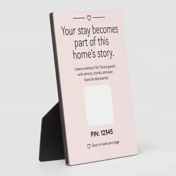 A QR guestbook plaque displayed inside a vacation rental